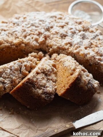 slices of gluten free carrot coffee cake topped with walnut streusel topping