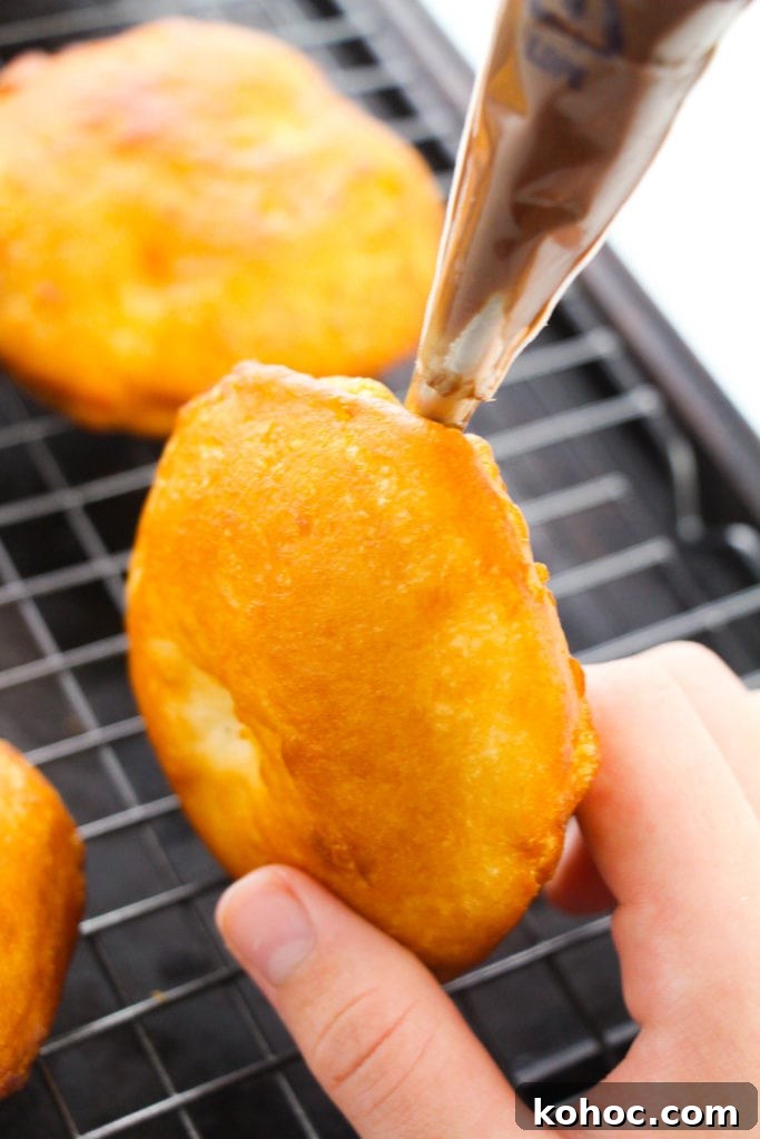 Homemade Nutella-Filled Donuts Recipe 9 Donuts dusted with powdered sugar