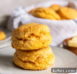 stack of two fluffy sweet potato biscuits on a small gray plate.