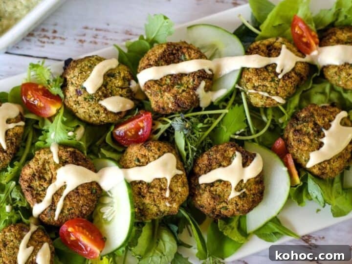 A plate of keto falafel with tzatziki sauce and pita bread.