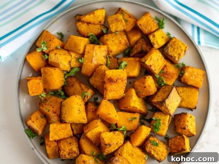 Roasted sweet potato cubes on a plate.