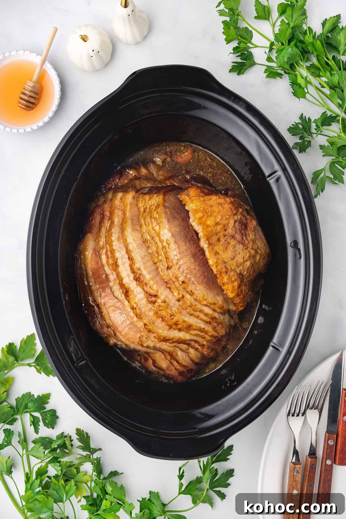 Slow Cooker Ham with Brown Sugar Glaze 7 Overhead view of ham in a slow cooker.