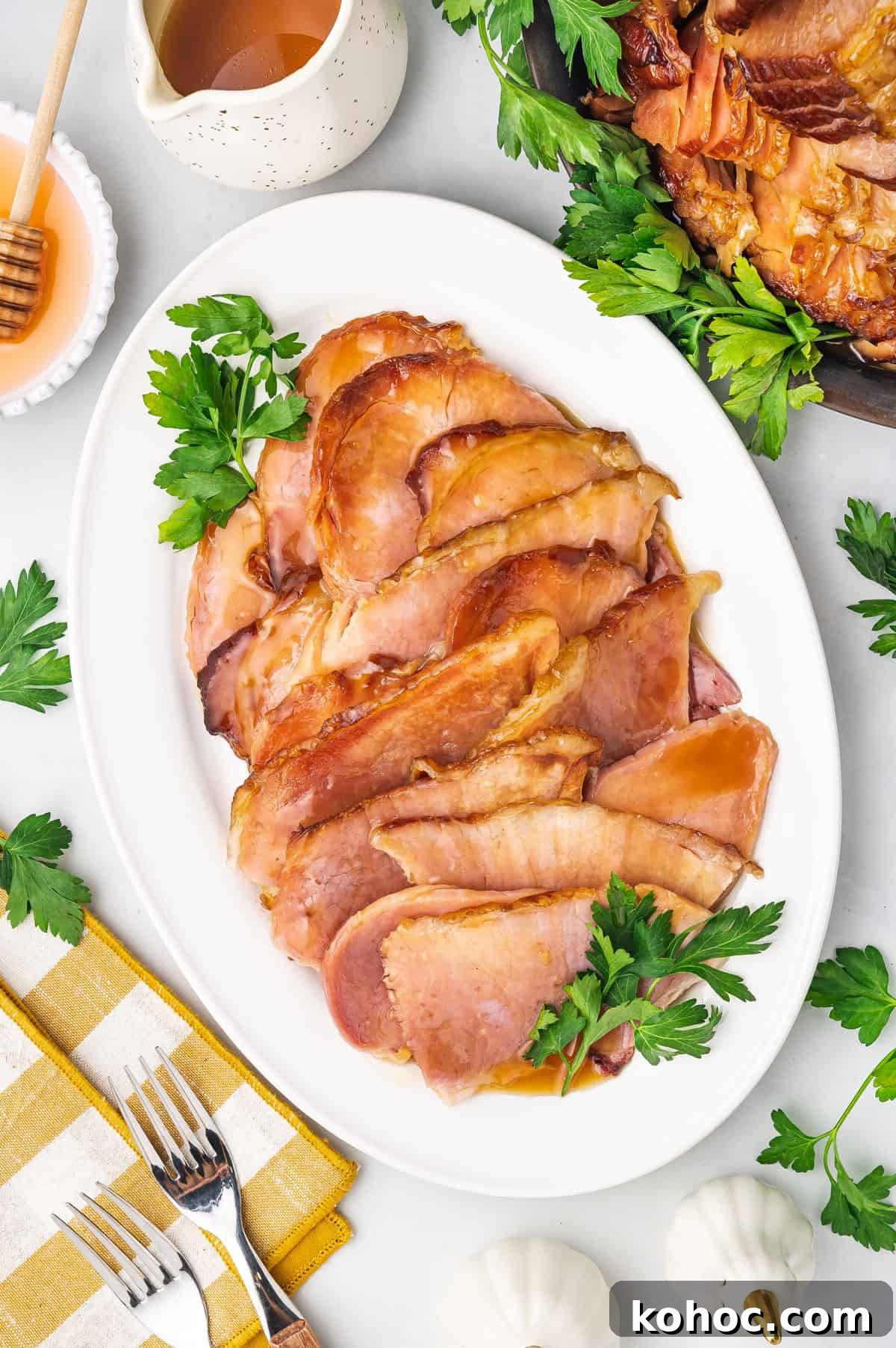 Slow Cooker Ham with Brown Sugar Glaze 9 Overhead view of sliced slow cooker ham on a platter.