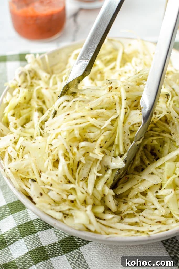 Swedish Pizza Salad: Tangy Cabbage Slaw with Dill 8 Tongs tossing a cabbage salad.