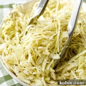 Swedish Pizza Salad: Tangy Cabbage Slaw with Dill 10 Tongs taking a portion of coleslaw.