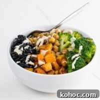 a black rice bowl with maple roasted butternut squash, sauteed chickpeas, broccoli, and tahini dressing