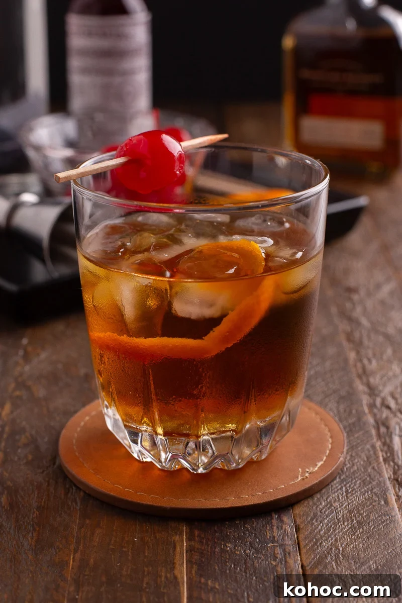 Classic Old Fashioned Cocktail Recipe with Bourbon 2 Old fashioned cocktail in glass with cherry.