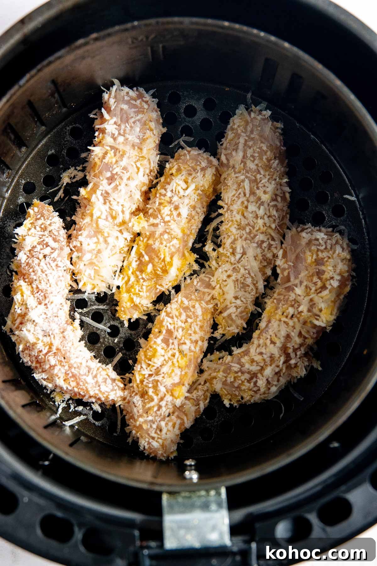 Breaded chicken in an air fryer.