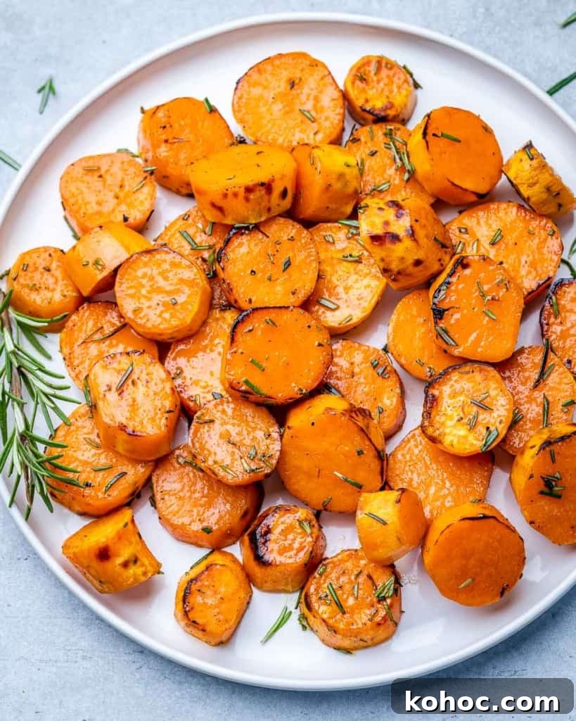 Crispy Roasted Sweet Potatoes with Garlic and Herbs 6 Roasted sweet potato on a white plate.