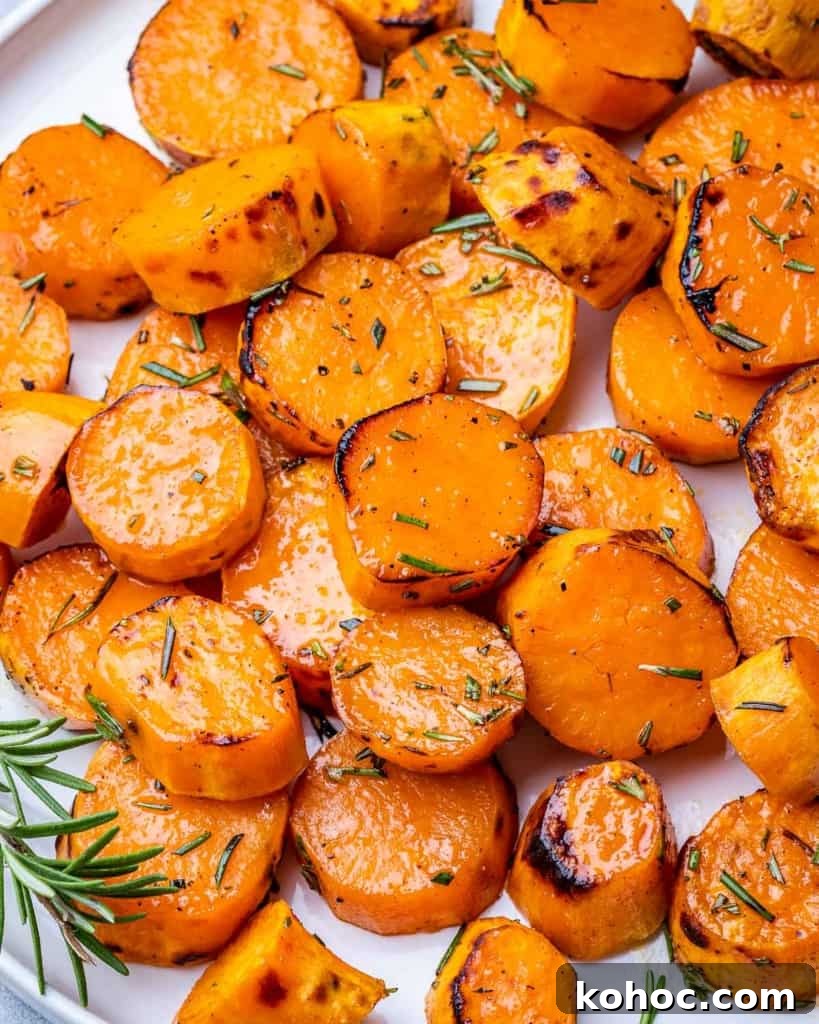 Crispy Roasted Sweet Potatoes with Garlic and Herbs 7 close up roasted sliced sweet potatoes on a plate
