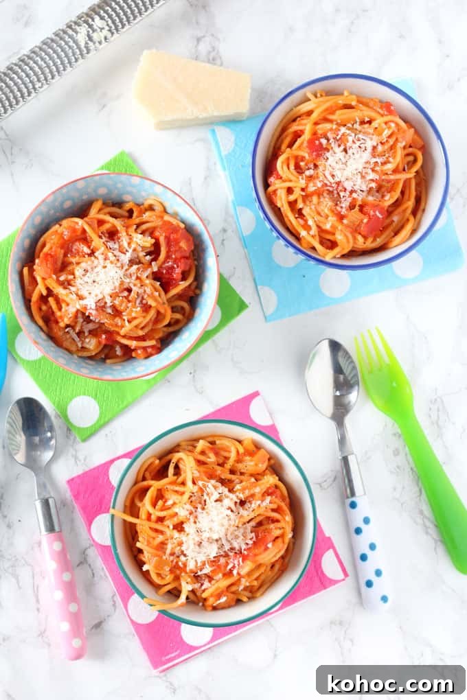 Tomato Spaghetti Kids Will Love 2 simple spaghetti & tomato sauce served in three small bowls on top of multi coloured polka dot napkins